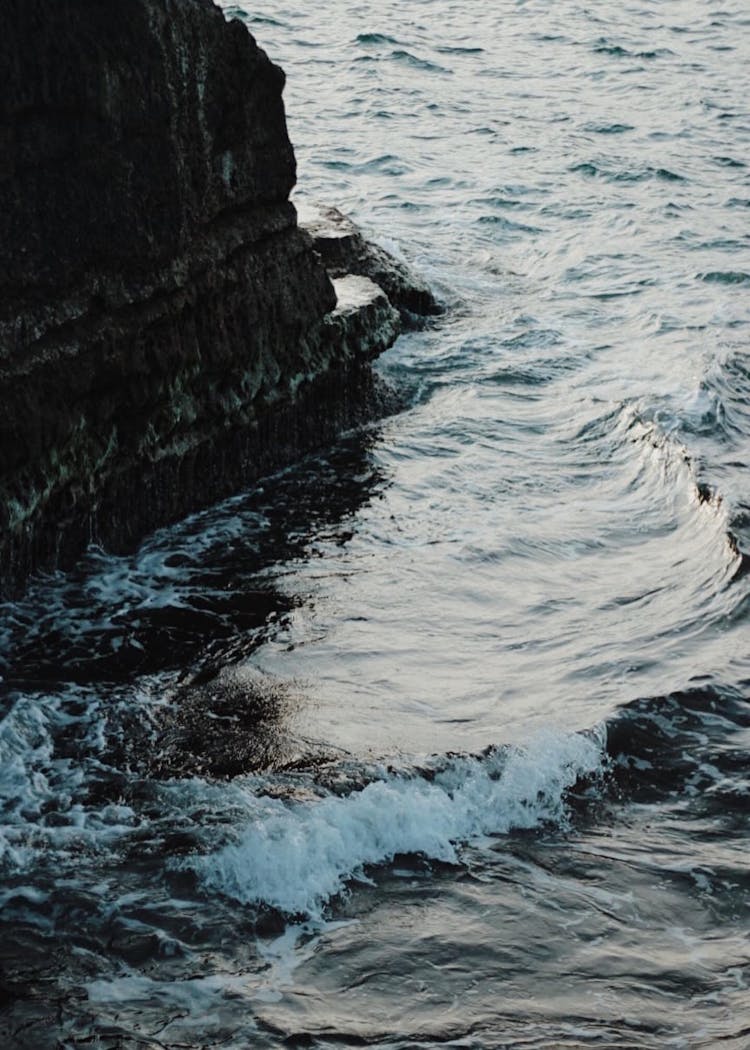 A Sea Wave Near A Rock