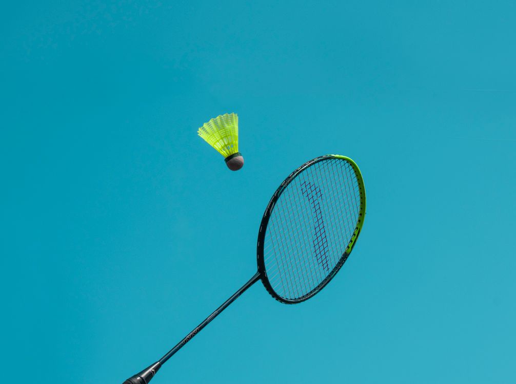 A Badminton Racket near a Shuttlecock · Free Stock Photo