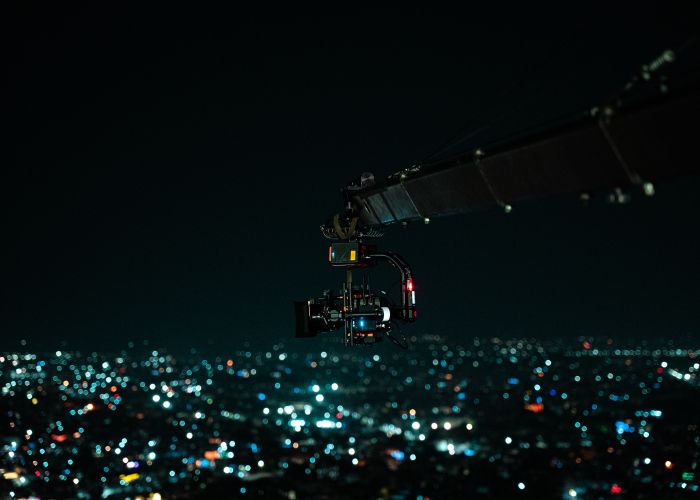 Cinematic drone camera capturing cityscape at night