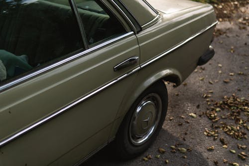Free Old withered mercedes 240d parking 2 Stock Photo