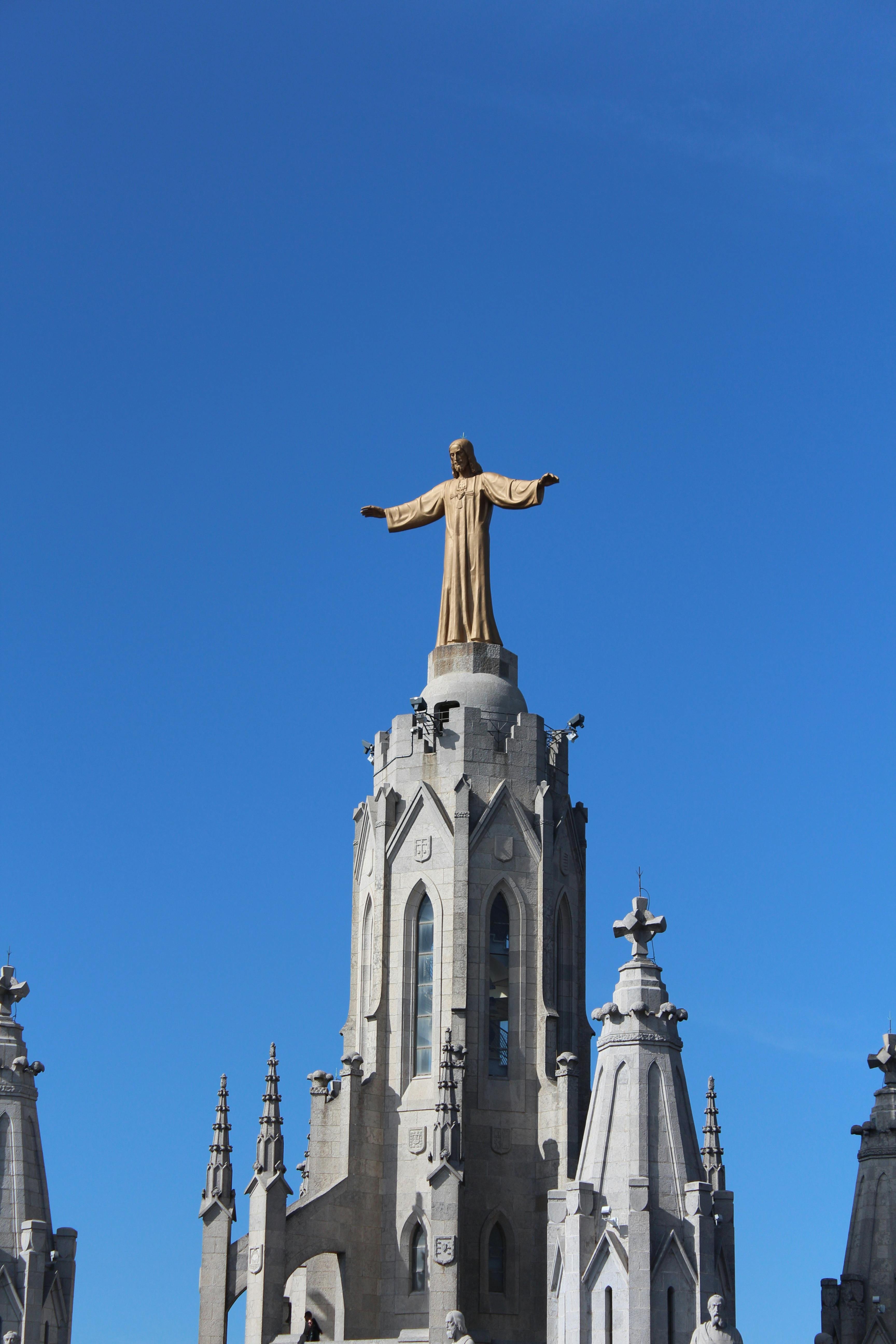 beige concrete sculpture under the blue sky