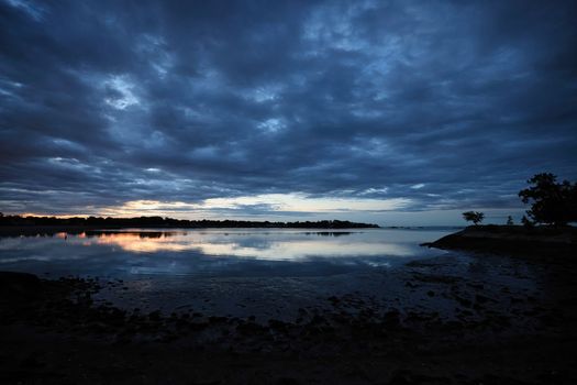 Dramatic sunset over Stamford Harbor in Connecticut, capturing the serene coastal beauty.