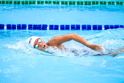 Person Swimming in Body of Water