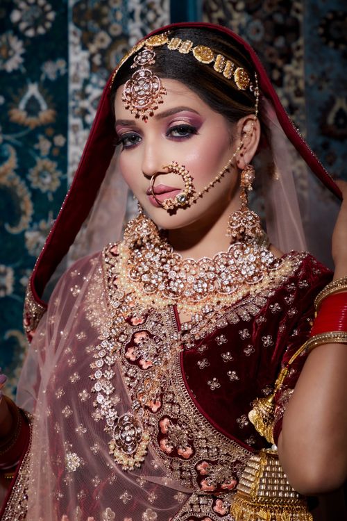 Free Close-up portrait of a woman in intricate cultural dress with jewelry. Stock Photo