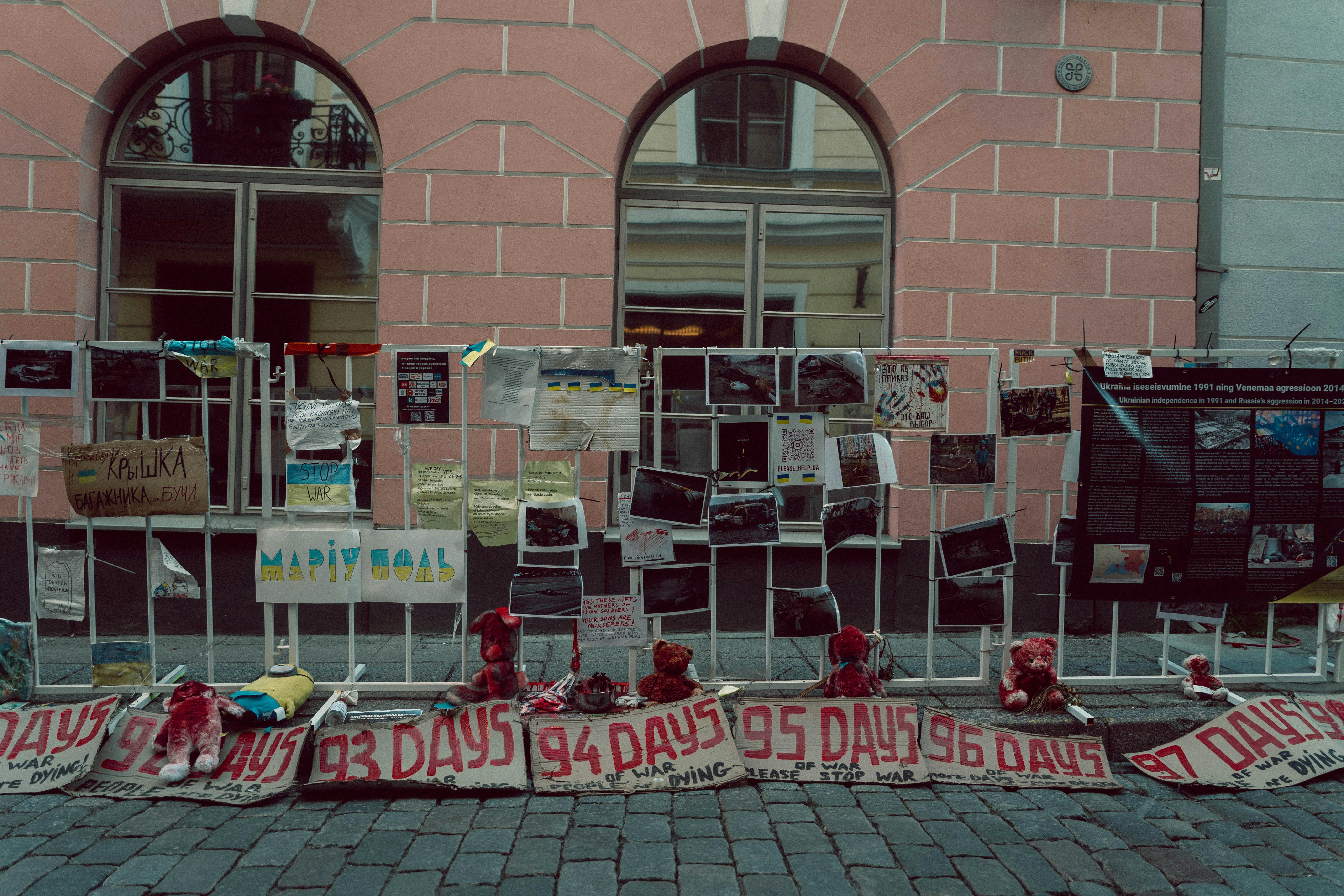 anti war banners on a fence