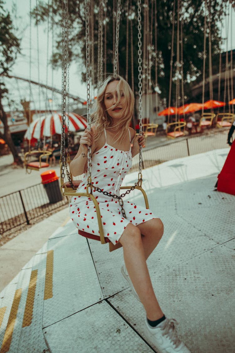 Young Woman On Ride In Entertainment Park