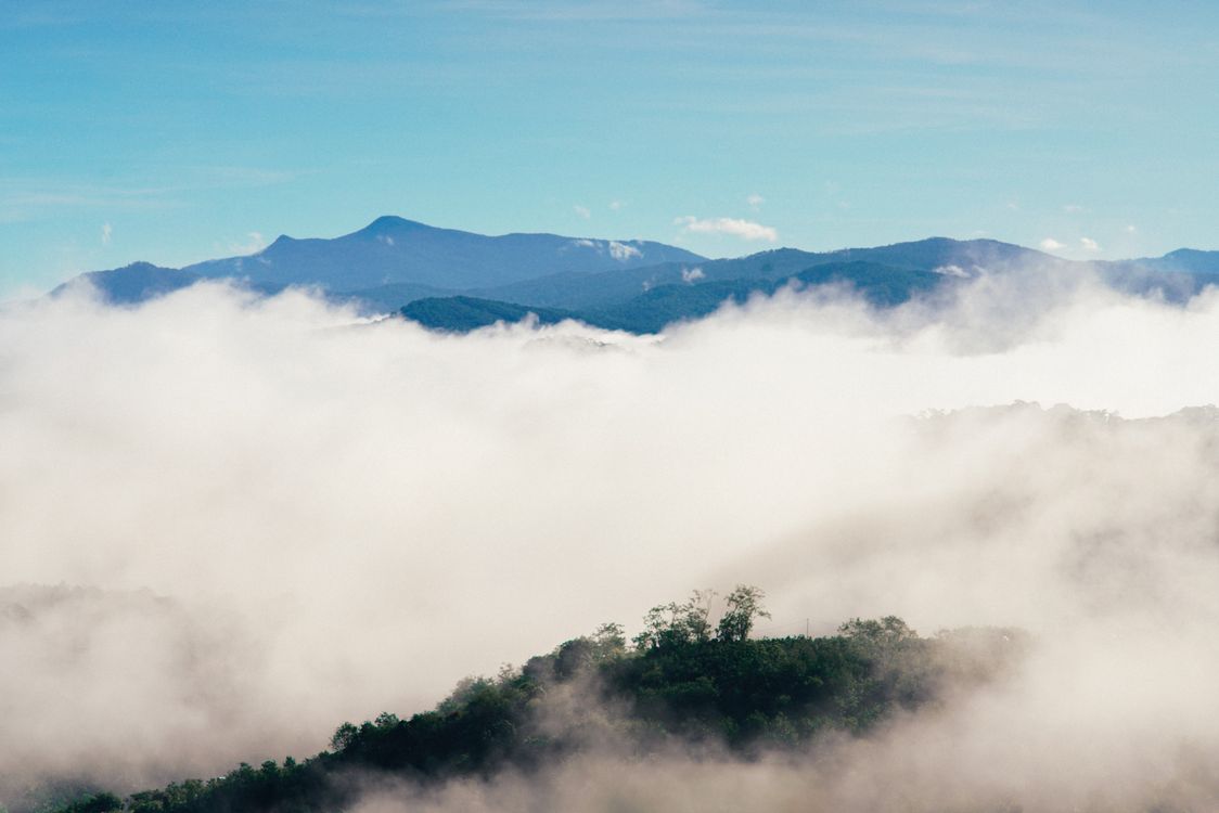 Mountain and Clouds Under Blue Sky · Free Stock Photo