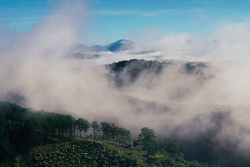 An Aerial Shot of a Mountain Range during a Foggy Day