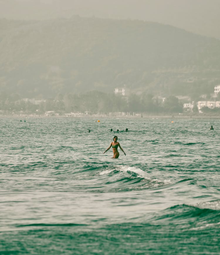 Woman Swimming In A Sea 