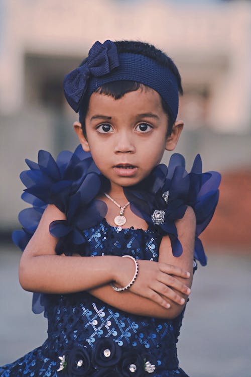 Cute Child in Blue Dress Posing