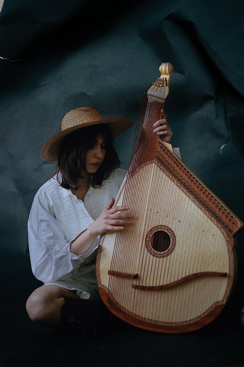 A Woman Playing a Bandura