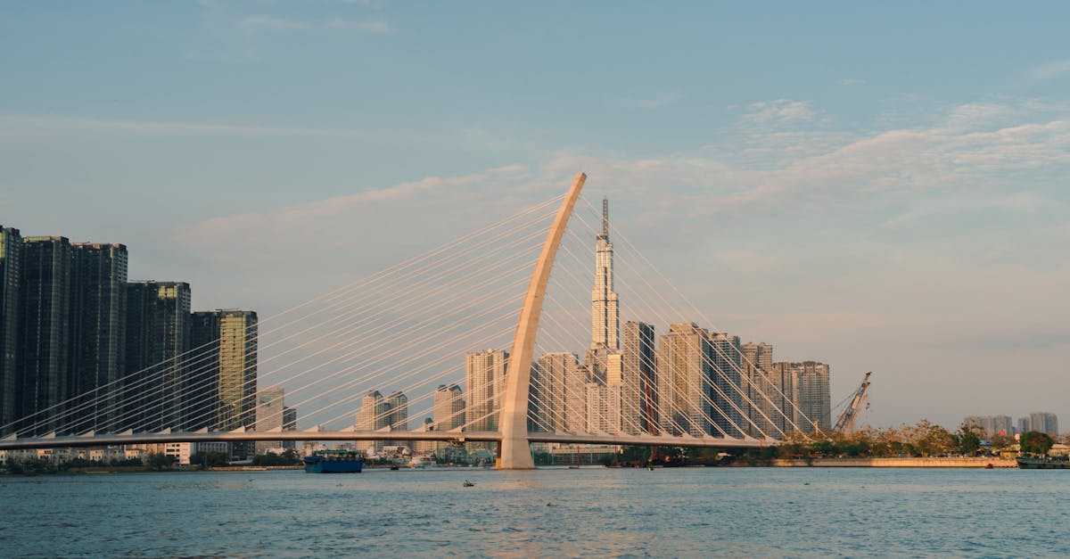 View of the modern cityscape and bridge over the Saigon River in Ho Chi Minh City.