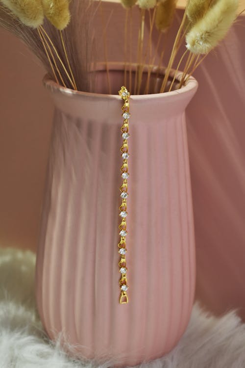 Gold Bracelet with Diamonds on Pink Vase