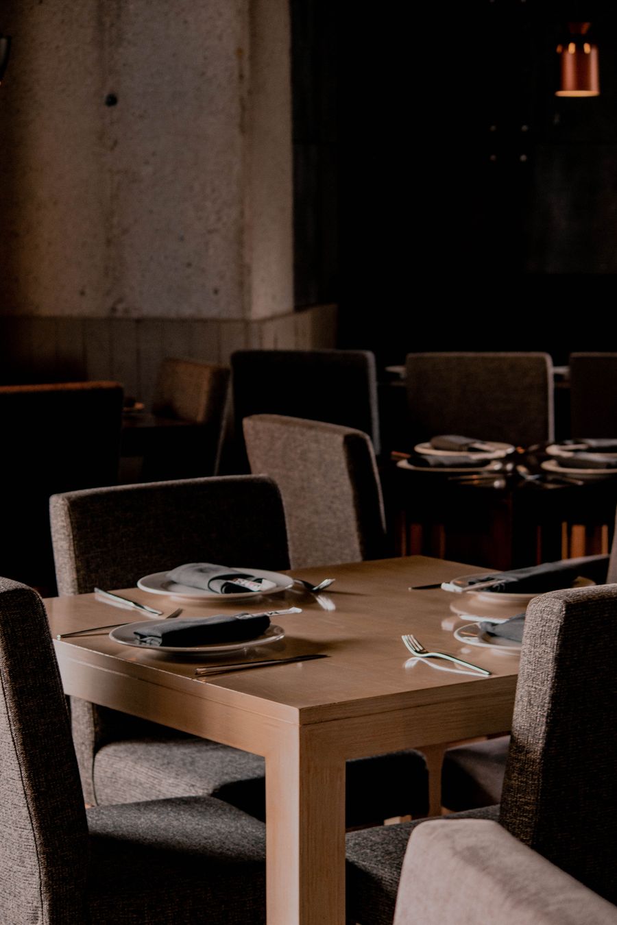 Interior with warm lighting and places to sit with a coffee