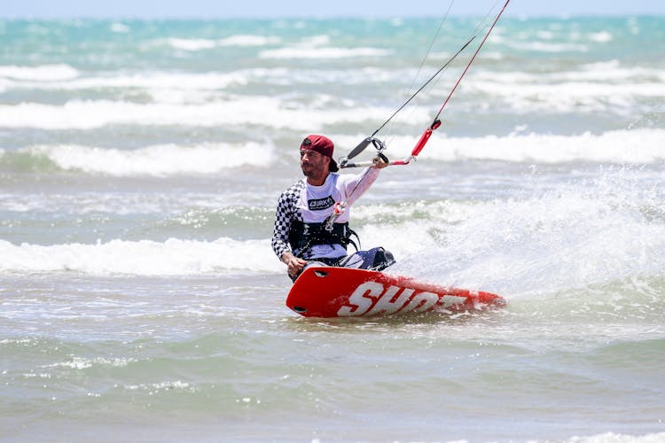 Man Surfing On Sea Wave