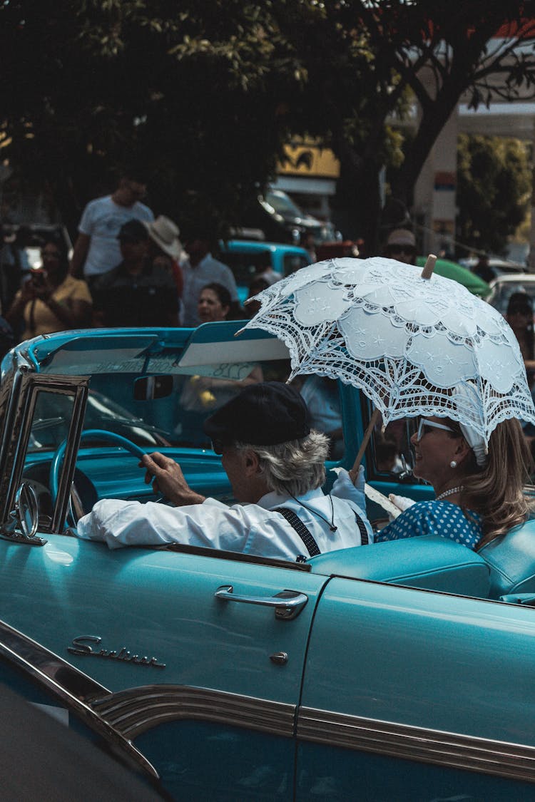 Woman And Man In Retro Car