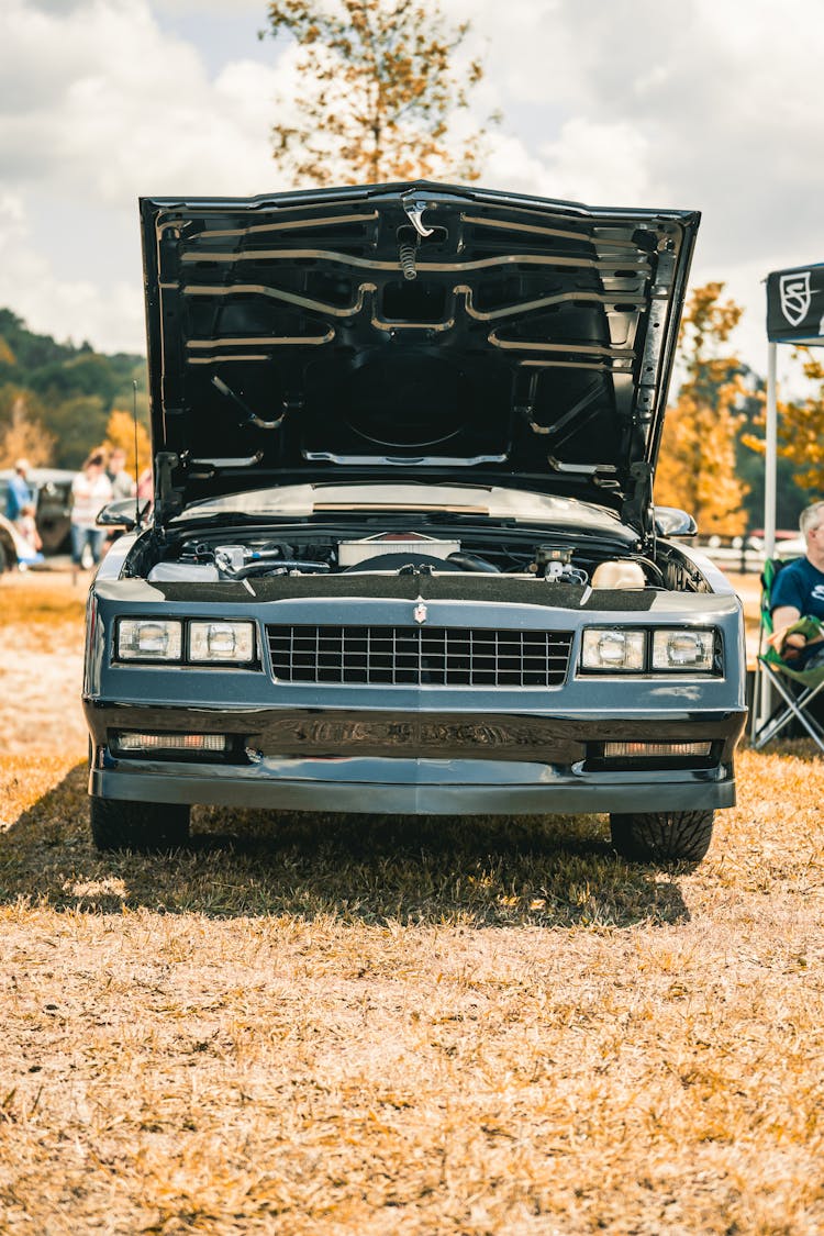 Retro Car With Open Hood Outdoors