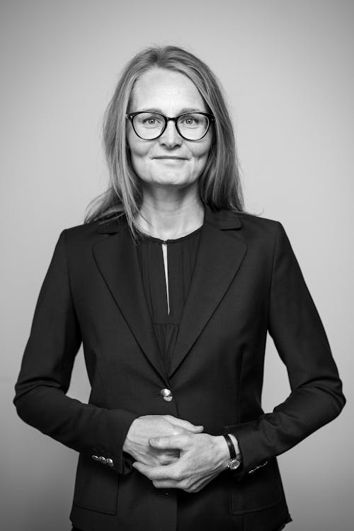 Woman in Black Blazer Wearing Eyeglasses