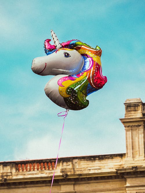 Rainbow Colored Unicorn Balloon Floating in the Air