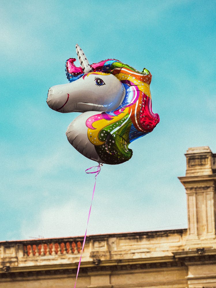 Rainbow Colored Unicorn Balloon Floating In The Air