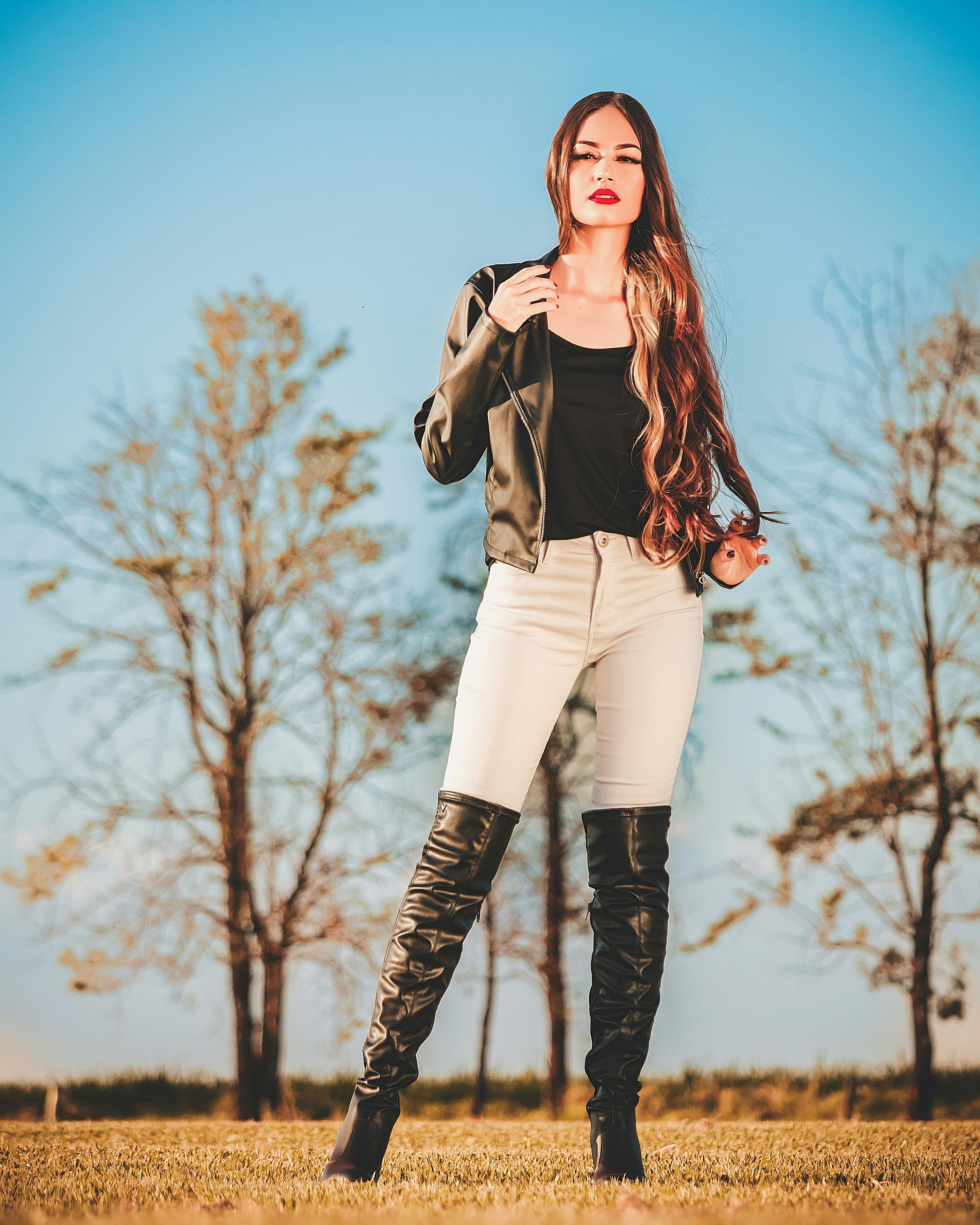 Photo of brunette in boots, underwear, leather jacket Stock Photo