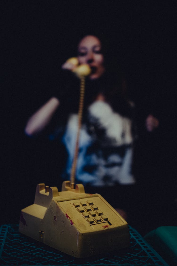 Woman Talking On Corded Phone