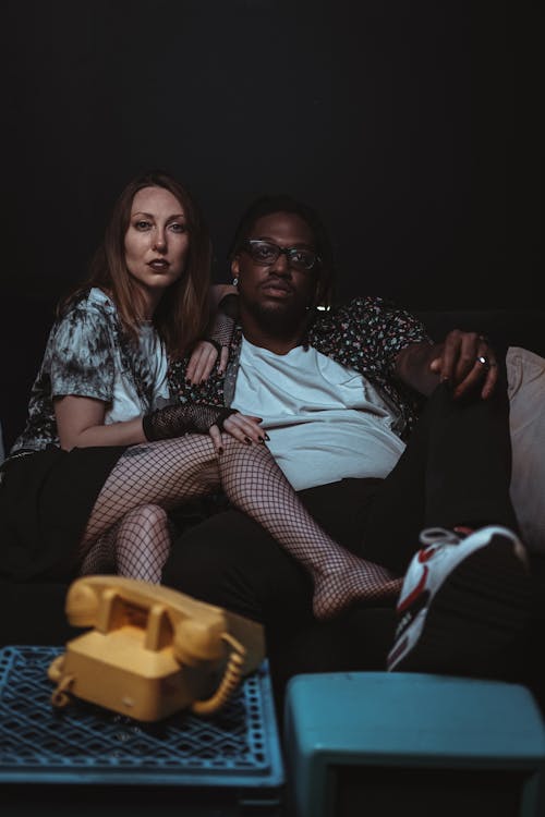 Man and Woman Posing on Sofa 