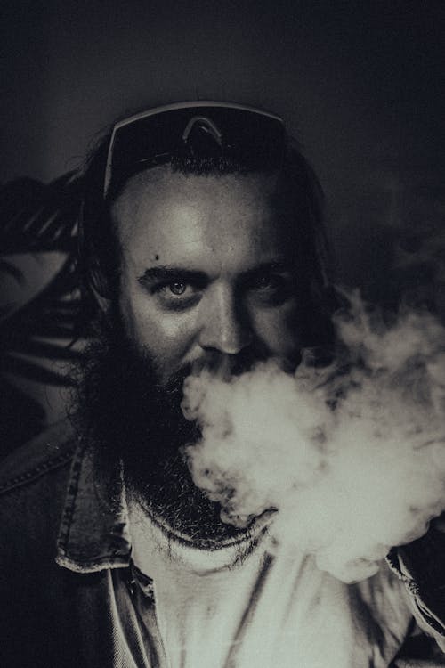 Free Grayscale Photo of a Bearded Man Smoking Cigarette Stock Photo