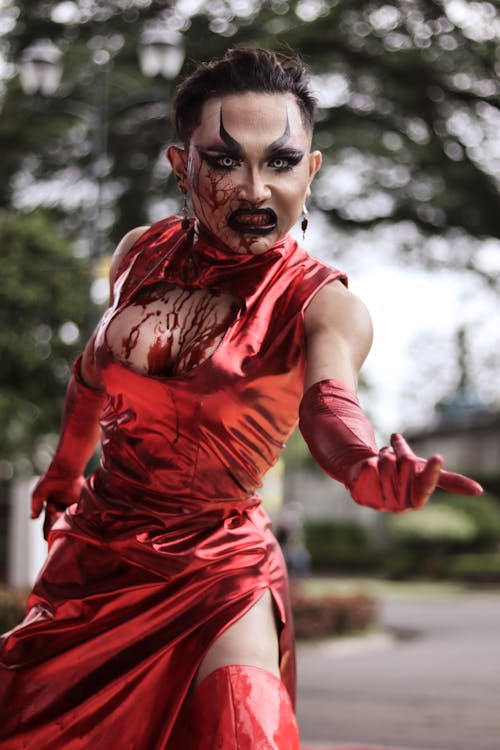 A Person in Scary Makeup and a Red Dress