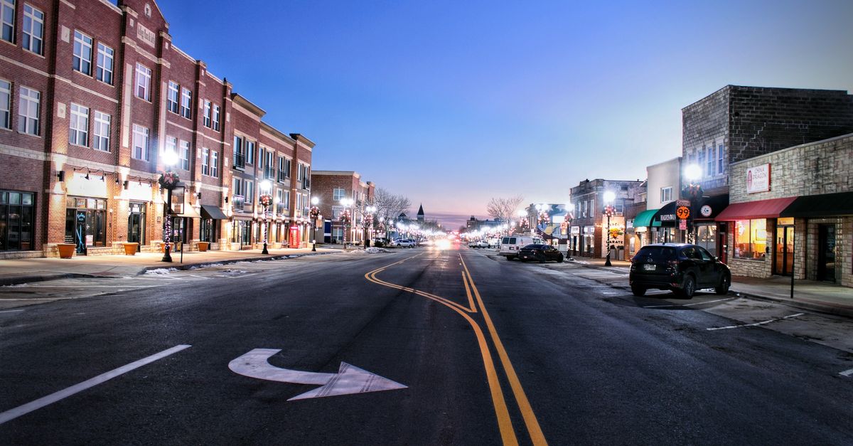 A serene twilight view of Main Street in Emporia, Kansas showcasing urban architecture.