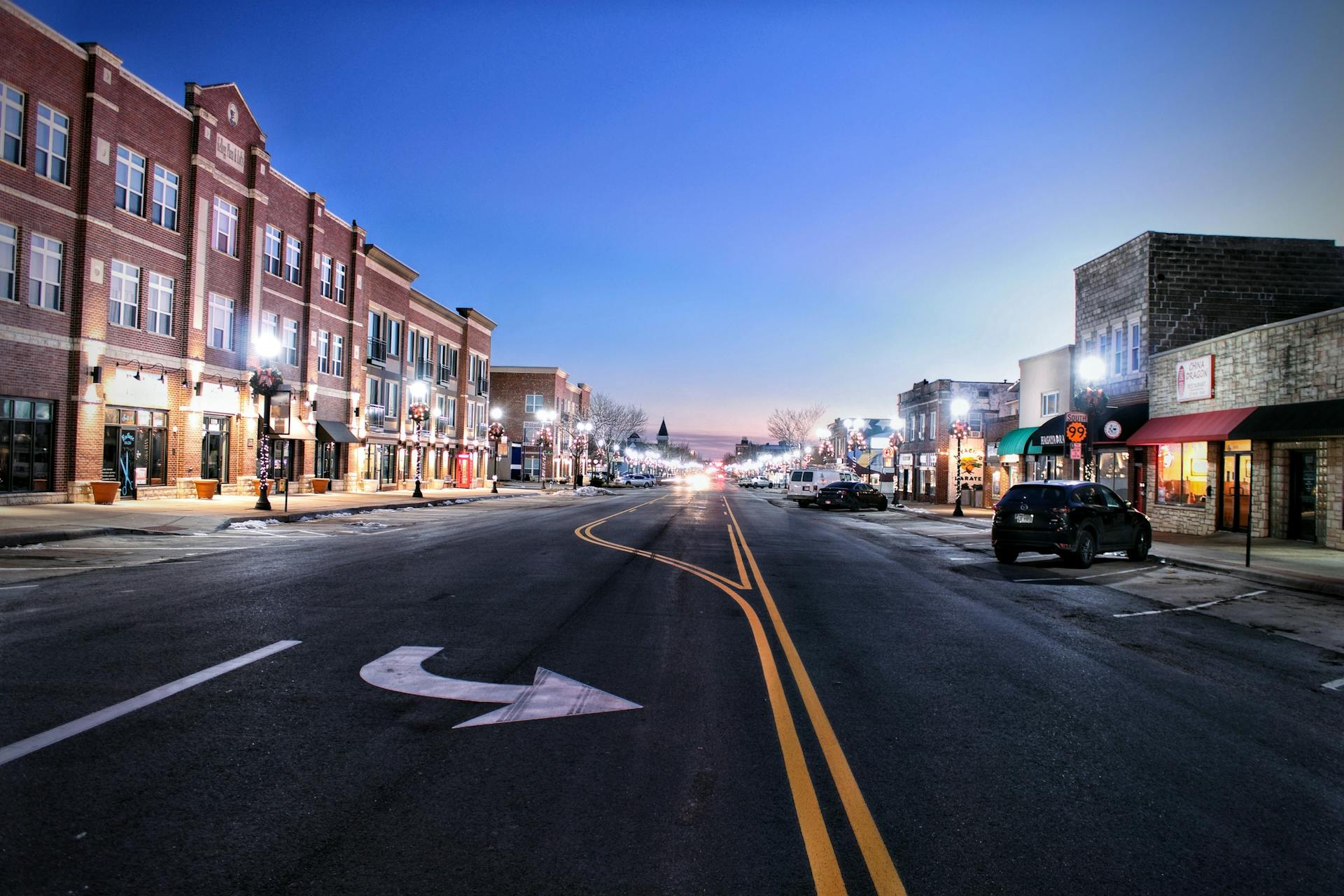 A serene twilight view of Main Street in Emporia, Kansas showcasing urban architecture.