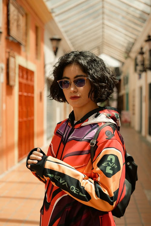 A Short Haired Woman in Printed Jacket Wearing Sunglasses
