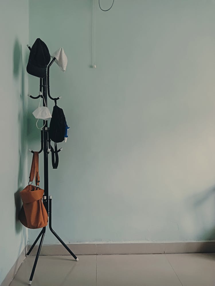 Protective Face Masks Hanging On A Coat Hook