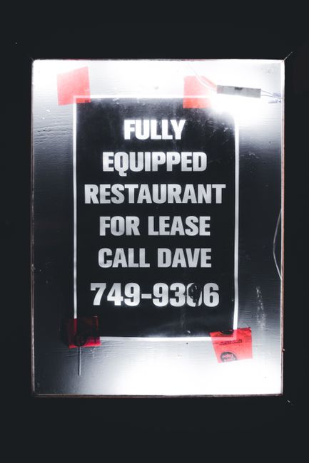 Photo by Erik Mclean A sign advertising a fully equipped restaurant for lease with contact details displayed.