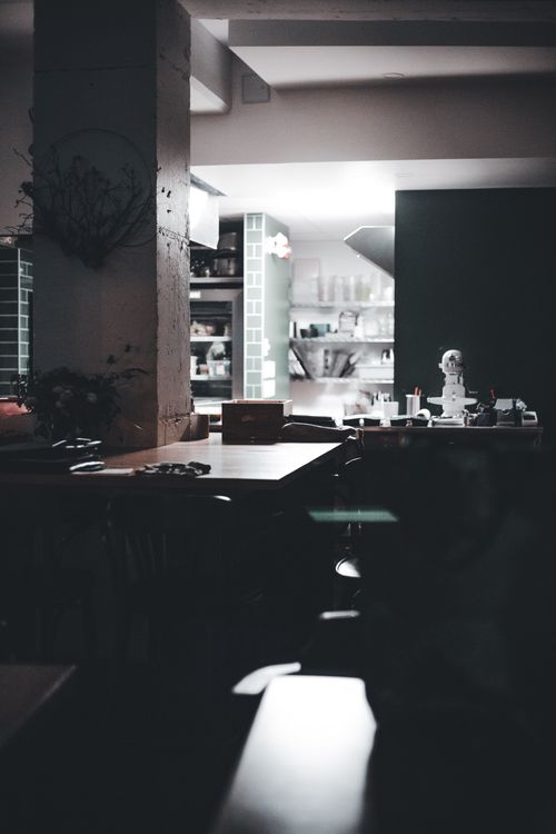 Free Atmospheric dimly lit kitchen interior with a rustic charm, showcasing warm home ambiance. Stock Photo
