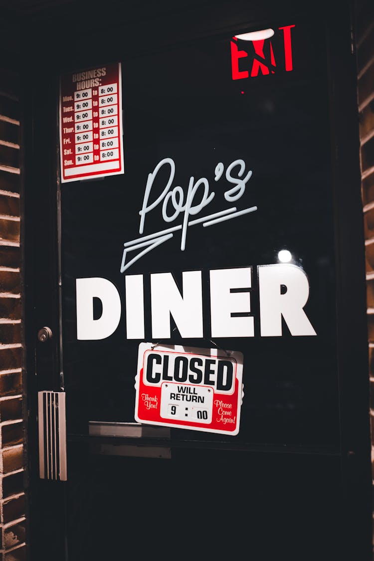 Signs On Door Of Diner