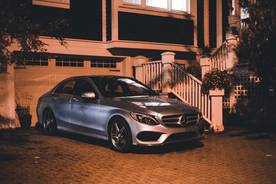 suburban driveway parked car evening