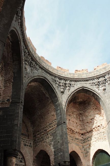 A scenic view of ancient arched architecture inside Saint George Church, Diyarbakir, Turkey.