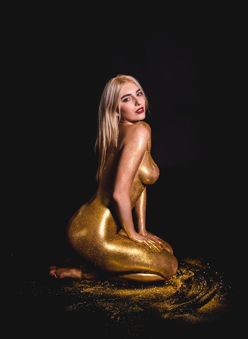 Free Woman Covered in Golden Glitter Stock Photo