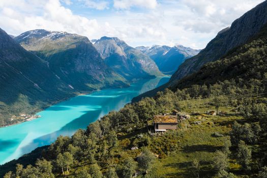 Breathtaking view of turquoise fjord and lush mountains in Vestland, Norway.