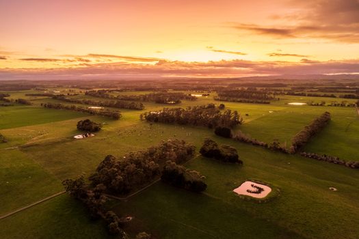 A breathtaking aerial view of a scenic countryside landscape during sunset, showcasing natural beauty.