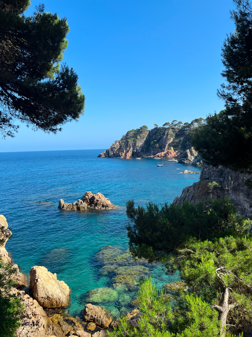 Free Breathtaking seaside landscape of Costa Brava with clear blue waters and rocky cliffs. Stock Photo