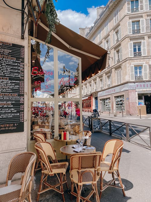 Brown Wooden Table and Chairs Near Store