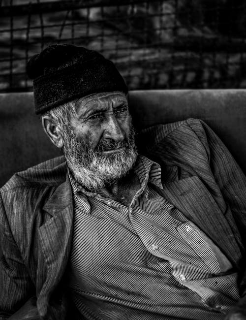 Grayscale Photo of an Elderly Man 