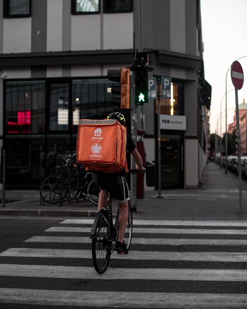 Deliveryman Riding a Bike