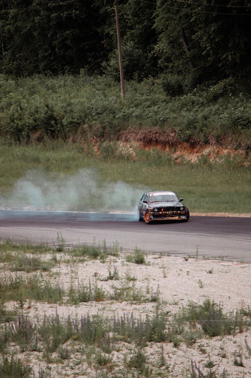 A Race Car Drifting at a Race Track