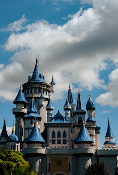 A stunning view of a fairy tale castle with blue rooftops in Sazova Park, Eskişehir, Turkey.