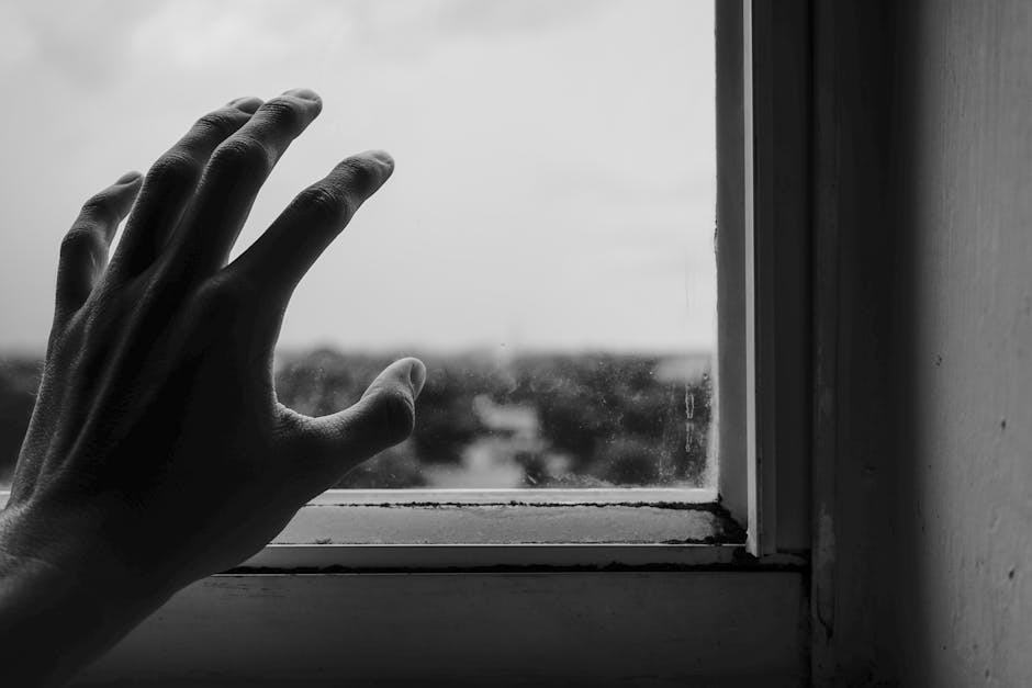 Close-Up Photography of Hand Near Window