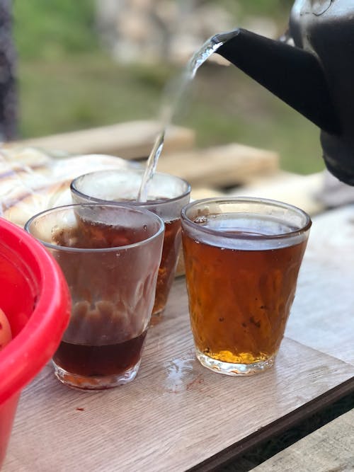 Free Hot Drink in Clear Glasses on a Wooden Plank Stock Photo