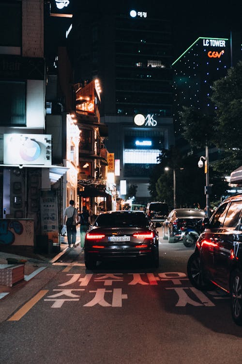 Cars on Road at Night Time